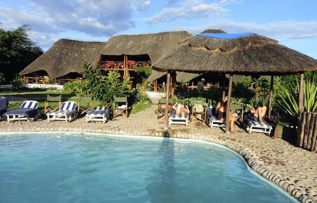 Swimming pool and main lodge at Manyara Wildlife Safari Lodge