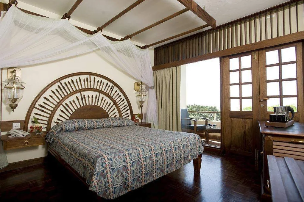 Cottage bedroom and dressing table at Manyara Wildlife Safari Lodge